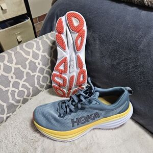 Hoka Women's Blue Running Shoes with Yellow and Red Accents